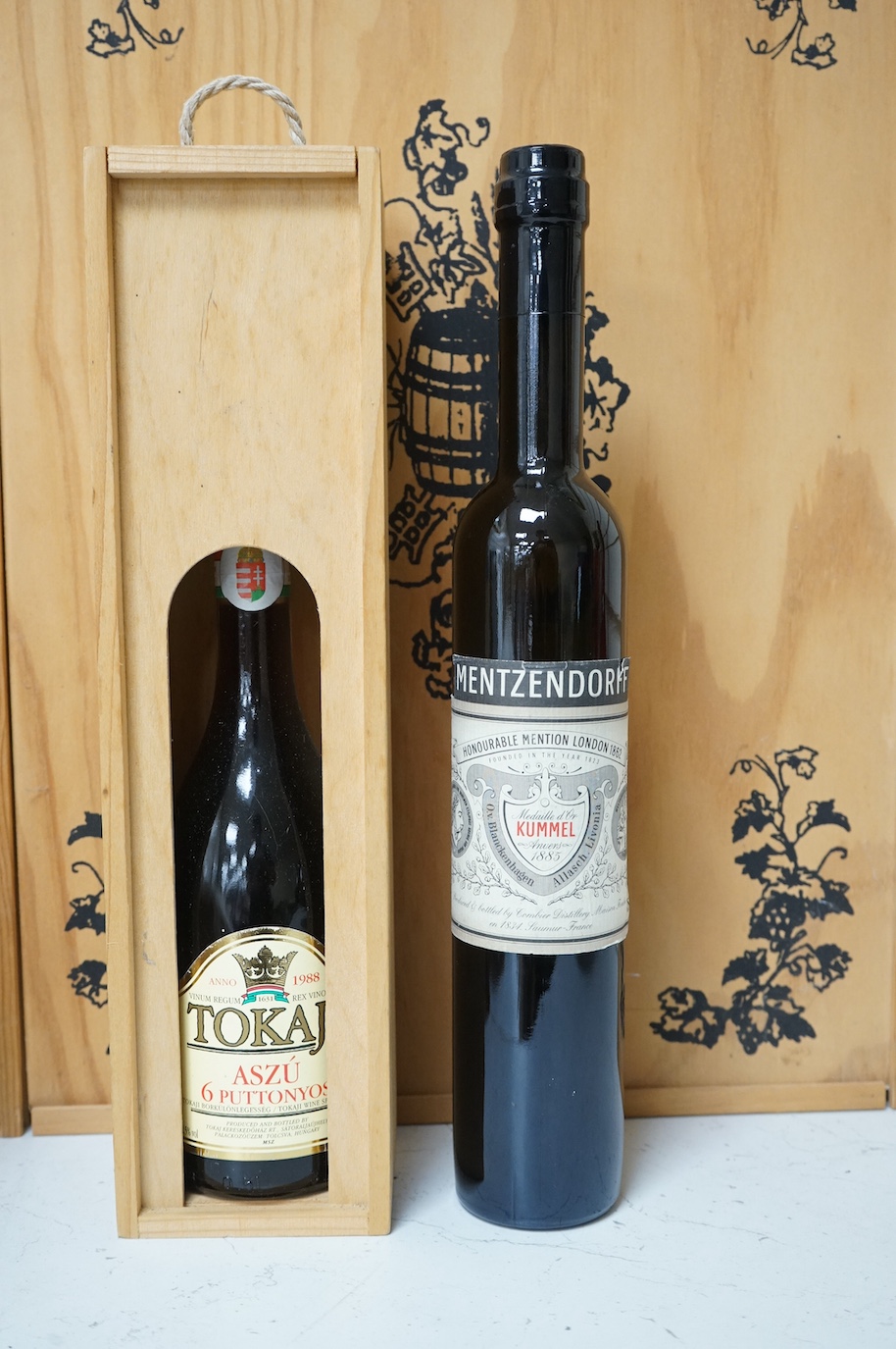One bottle of Kummel, another, Tokaji, and a Joyeux Anniversaire, cased